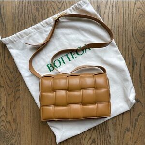 Bottega Veneta Classic Padded Cassette Bag in Camel. Originally $4900, $2900.